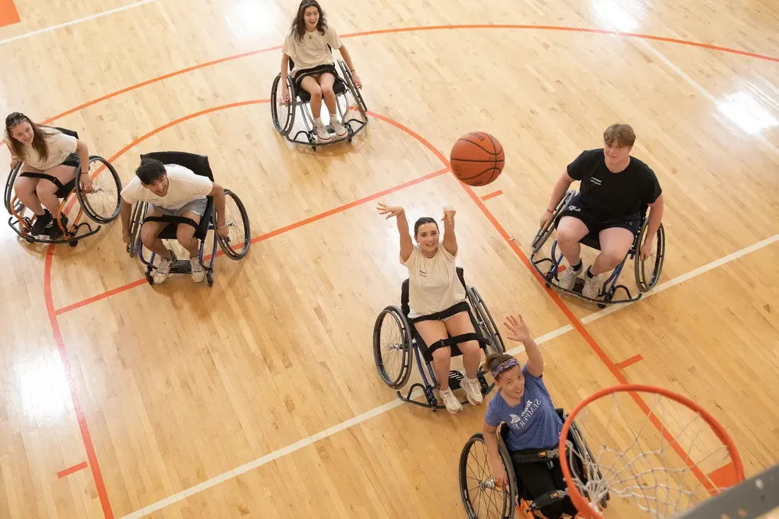 Students participating in hoops on wheels.